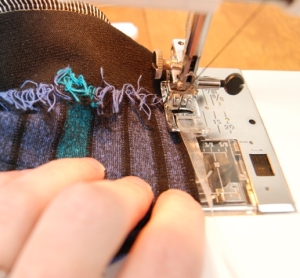 Sew your elastic to the upper edge while gently stretching